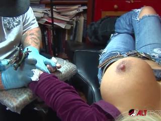Shyla Stylez gets Tattooed While Playing with Her Tits